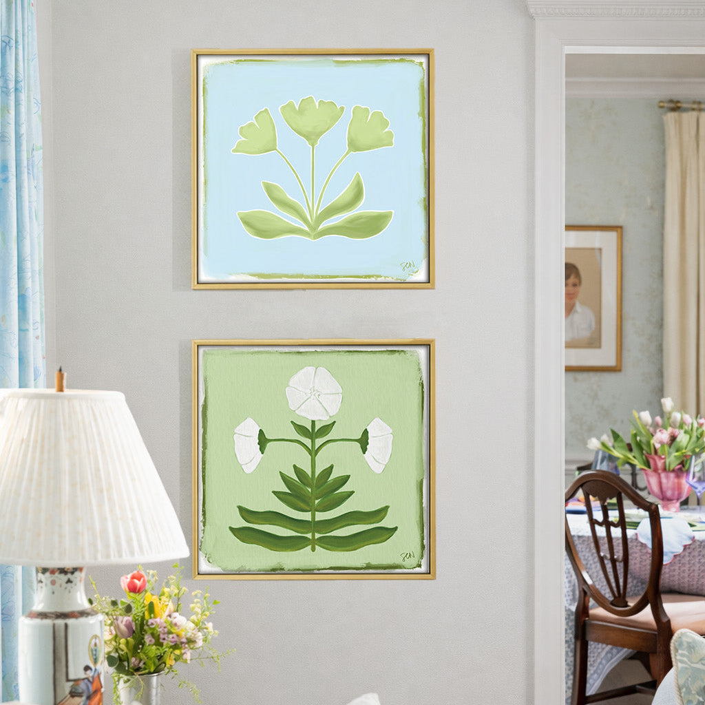 Living room with floral artwork on the wall and a lamp.